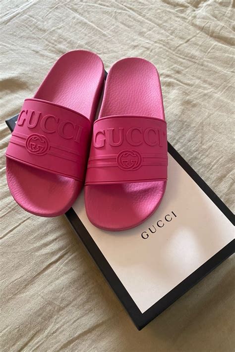 hot pink gucci slides.